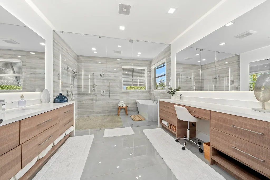 Front exterior of 2900 NE 23 Place Pompano Beach with lush landscaping and circular driveway