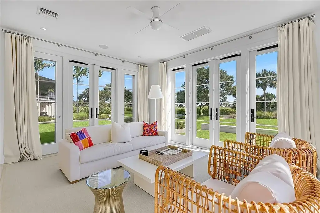 Resort-style pool and spa surrounded by palm trees at 3340 Savannah Pl in Windsor, Vero Beach