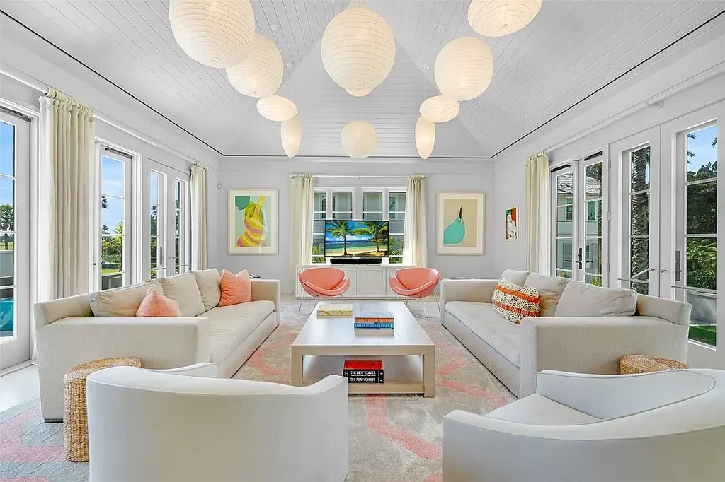 Resort-style pool and spa surrounded by palm trees at 3340 Savannah Pl in Windsor, Vero Beach