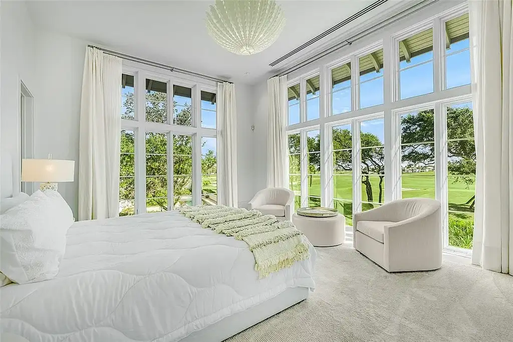Resort-style pool and spa surrounded by palm trees at 3340 Savannah Pl in Windsor, Vero Beach