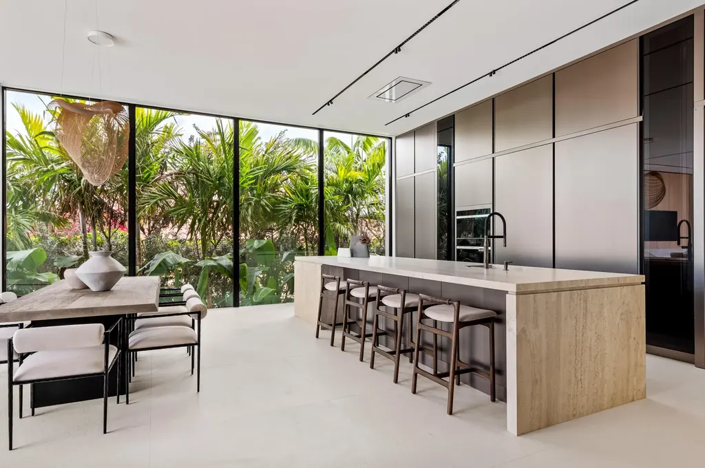 Modern waterfront home at 35 Spoonbill Road Manalapan with white-oak fins and sculptural architecture