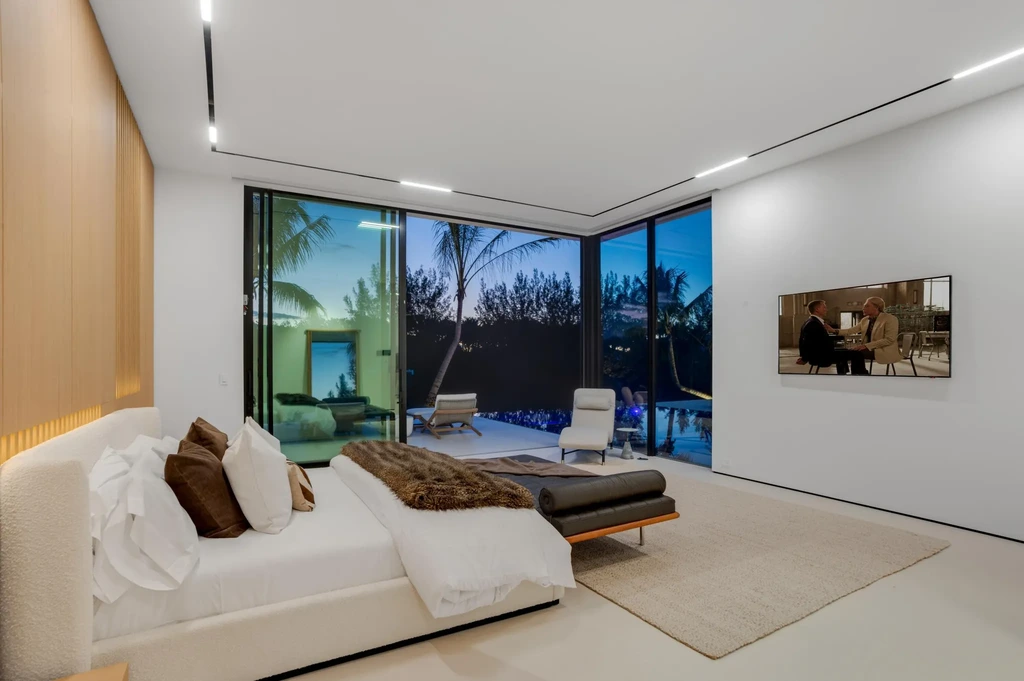 Modern waterfront home at 35 Spoonbill Road Manalapan with white-oak fins and sculptural architecture
