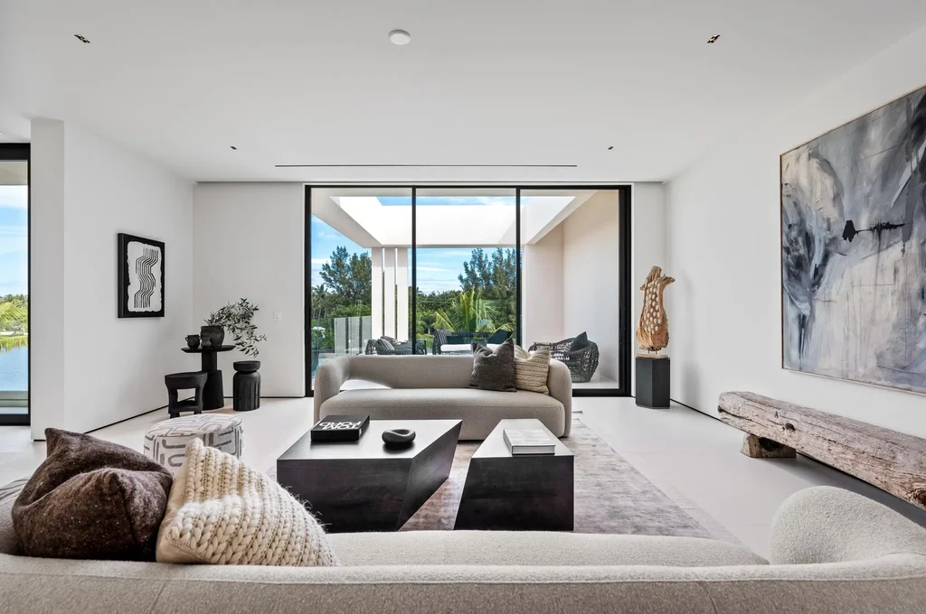 Modern waterfront home at 35 Spoonbill Road Manalapan with white-oak fins and sculptural architecture