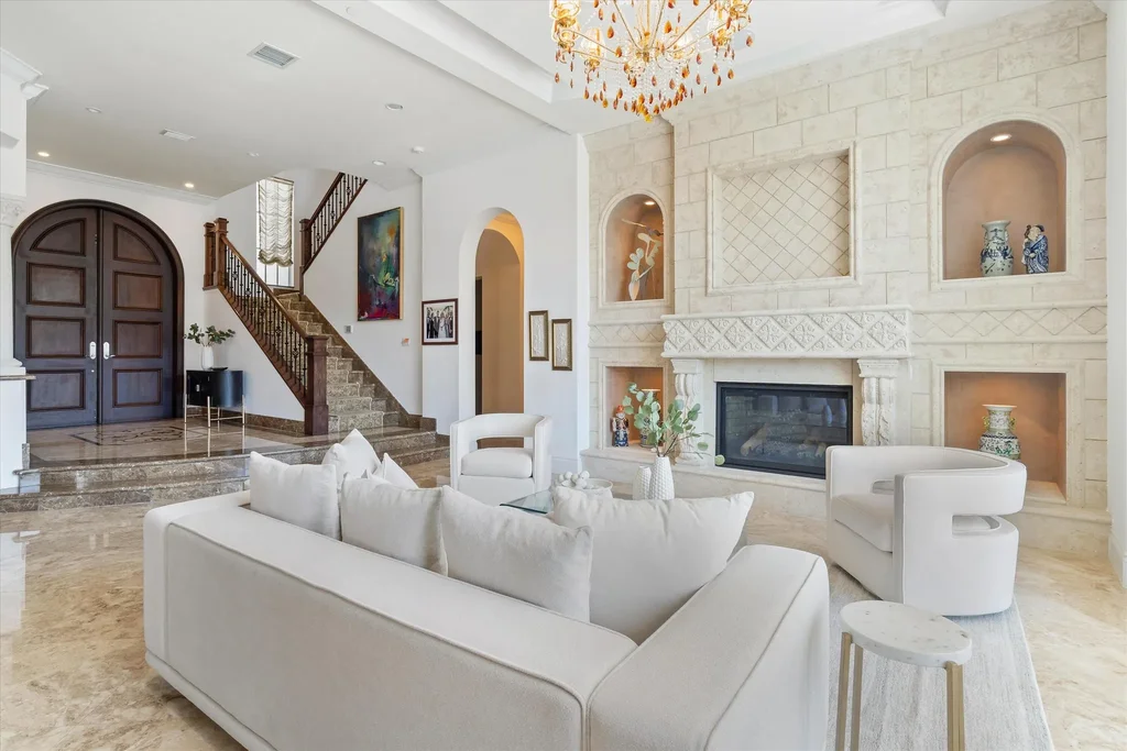 Spacious living room with marble floors and canal views at 932 Banyan Drive