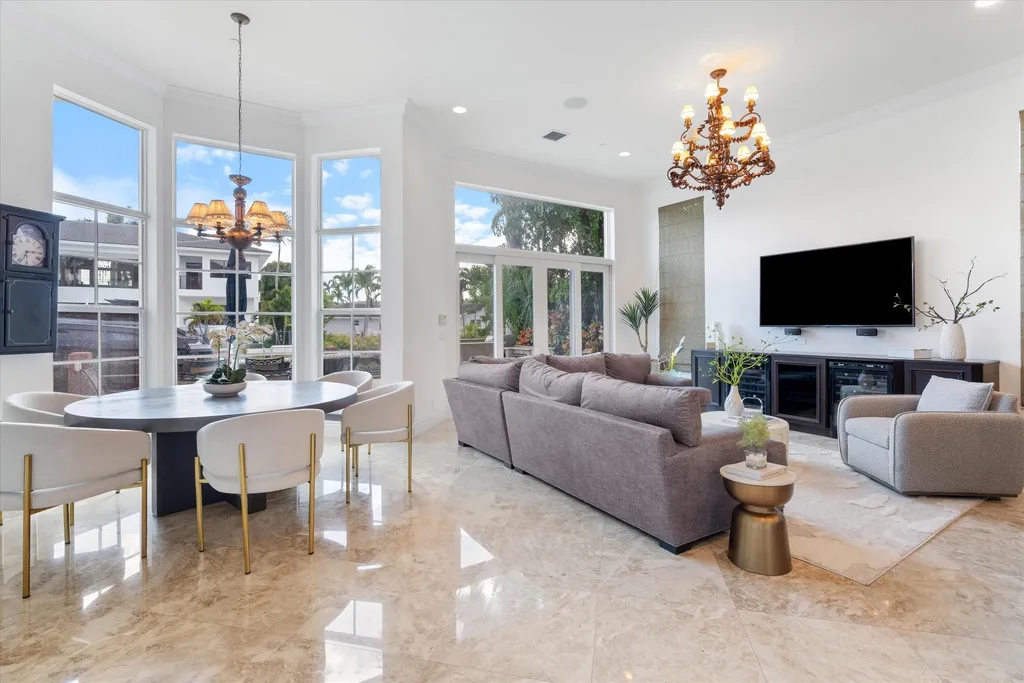 Spacious living room with marble floors and canal views at 932 Banyan Drive