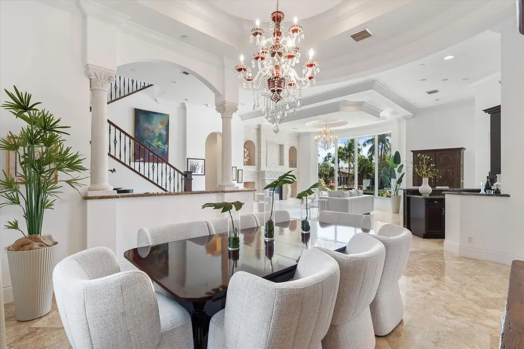 Spacious living room with marble floors and canal views at 932 Banyan Drive