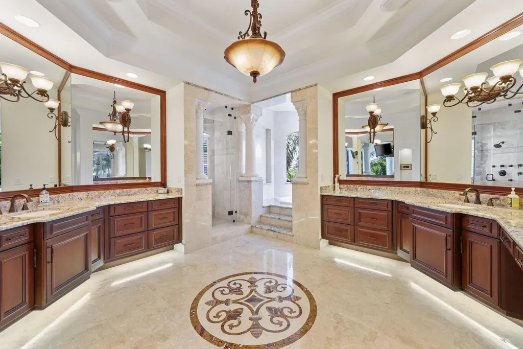 Spacious living room with marble floors and canal views at 932 Banyan Drive