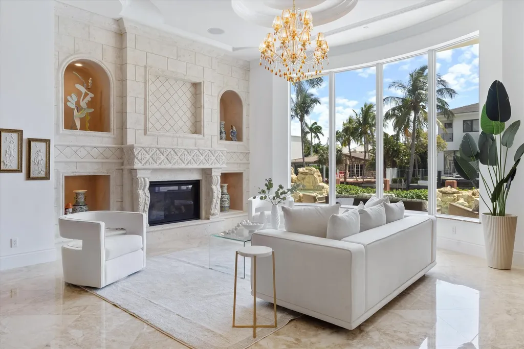 Spacious living room with marble floors and canal views at 932 Banyan Drive