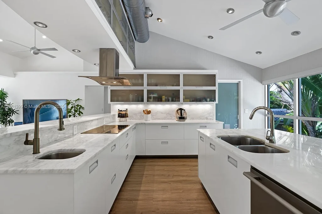 144 N Prospect Dr Coral Gables home for sale – $5.39M luxury residence designed by Hilario Candela featuring modern updates, private pool, and lush greenery.