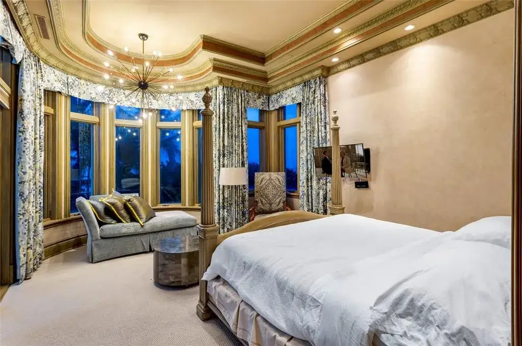 Elegant living room at 2306 Bay Dr featuring marble floors, high ceilings, and panoramic ocean views