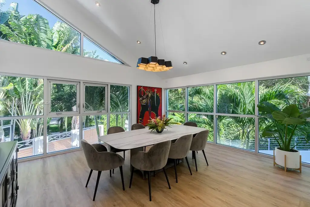 144 N Prospect Dr Coral Gables home for sale – $5.39M luxury residence designed by Hilario Candela featuring modern updates, private pool, and lush greenery.