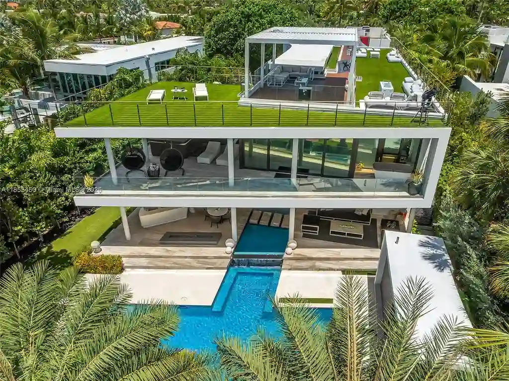Aerial view of 528 Lakeview Ct modern waterfront estate in Miami Beach with luxury pool, private dock, and panoramic Intracoastal views