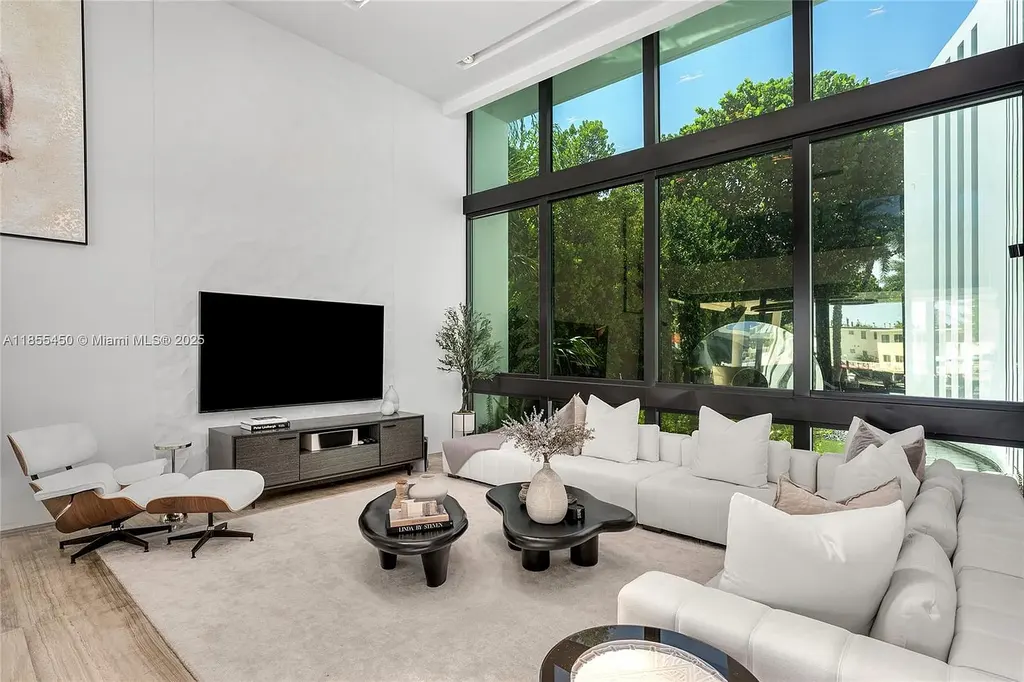 Aerial view of 528 Lakeview Ct modern waterfront estate in Miami Beach with luxury pool, private dock, and panoramic Intracoastal views