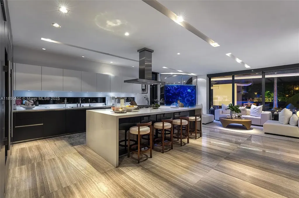 Aerial view of 528 Lakeview Ct modern waterfront estate in Miami Beach with luxury pool, private dock, and panoramic Intracoastal views