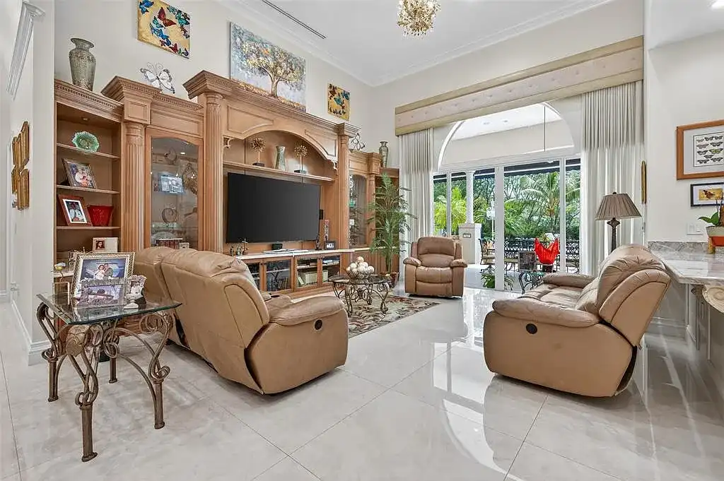 Luxury Mediterranean villa at 5801 Estates Dr in Southwest Ranches featuring resort-style saltwater pool, tropical gardens, and elegant architecture