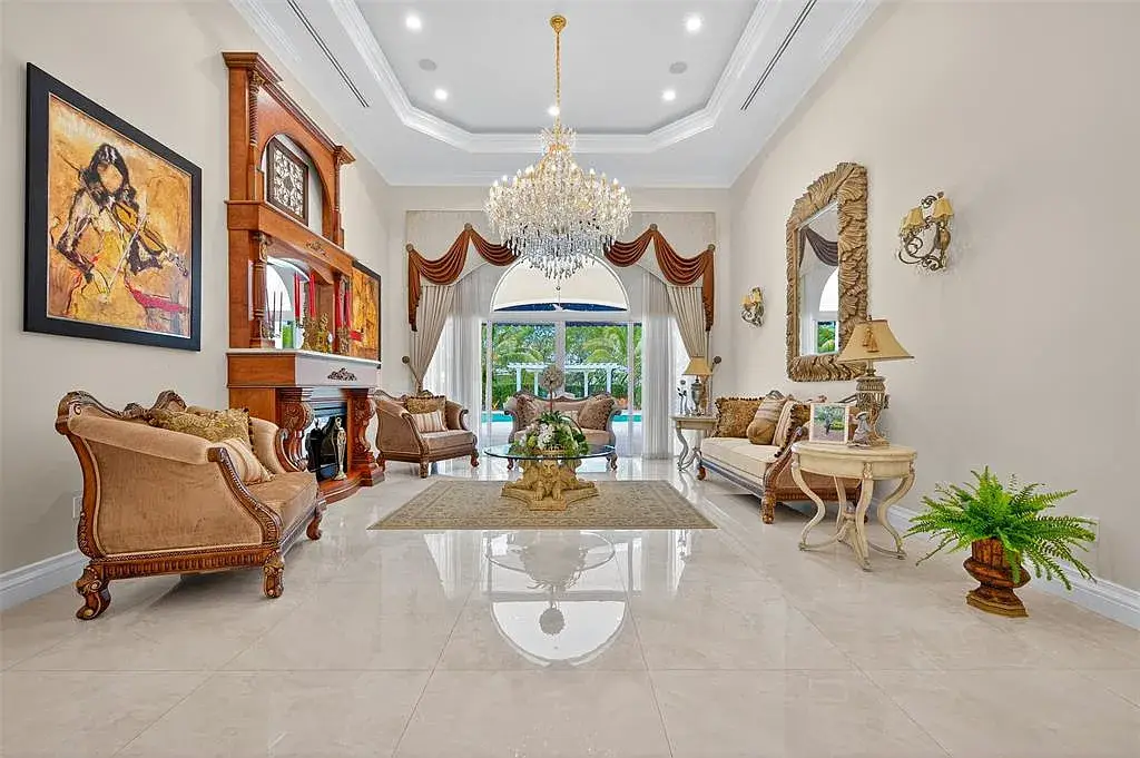 Luxury Mediterranean villa at 5801 Estates Dr in Southwest Ranches featuring resort-style saltwater pool, tropical gardens, and elegant architecture