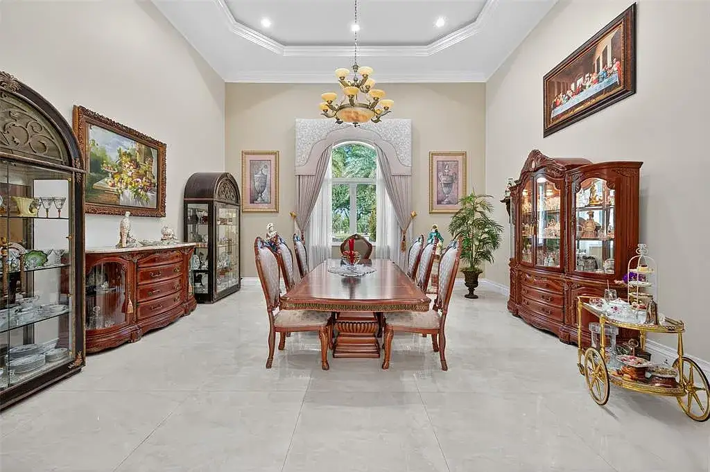 Luxury Mediterranean villa at 5801 Estates Dr in Southwest Ranches featuring resort-style saltwater pool, tropical gardens, and elegant architecture