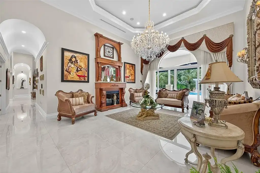 Luxury Mediterranean villa at 5801 Estates Dr in Southwest Ranches featuring resort-style saltwater pool, tropical gardens, and elegant architecture