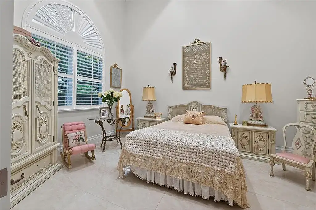 Luxury Mediterranean villa at 5801 Estates Dr in Southwest Ranches featuring resort-style saltwater pool, tropical gardens, and elegant architecture