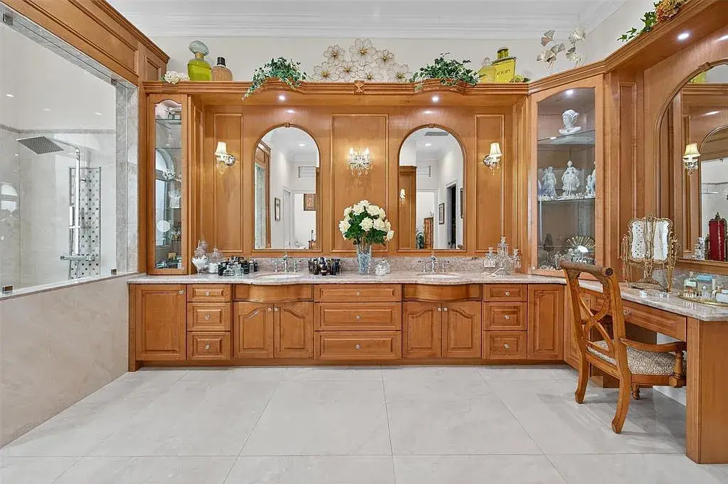 Luxury Mediterranean villa at 5801 Estates Dr in Southwest Ranches featuring resort-style saltwater pool, tropical gardens, and elegant architecture