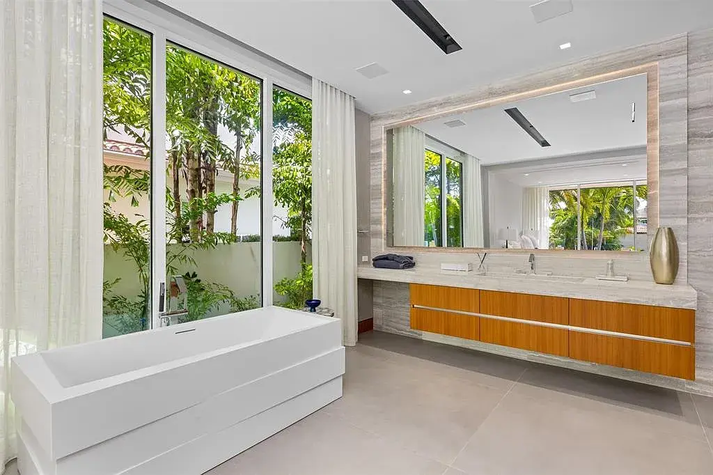 Exterior view of 650 Royal Plaza Dr, a $19.75M modern smart-home waterfront estate in Fort Lauderdale featuring 131 feet of canal frontage and luxury amenities.