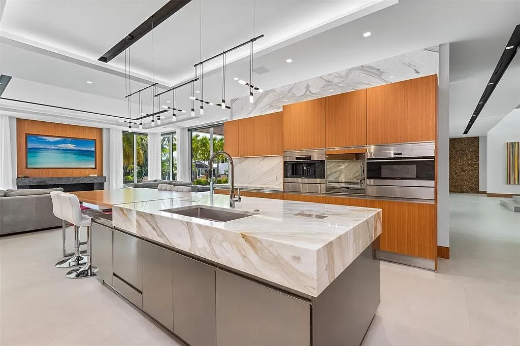Exterior view of 650 Royal Plaza Dr, a $19.75M modern smart-home waterfront estate in Fort Lauderdale featuring 131 feet of canal frontage and luxury amenities.