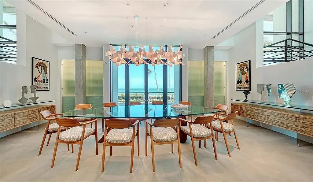 Gulf-front luxury home at 8250 Sanderling Rd in Sarasota, award-winning modern architecture with beach and lagoon frontage.