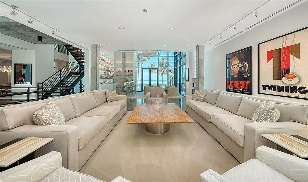 Gulf-front luxury home at 8250 Sanderling Rd in Sarasota, award-winning modern architecture with beach and lagoon frontage.