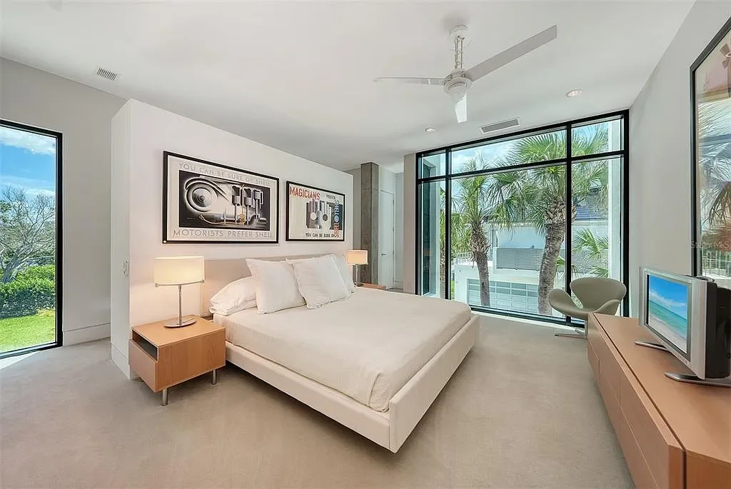Gulf-front luxury home at 8250 Sanderling Rd in Sarasota, award-winning modern architecture with beach and lagoon frontage.