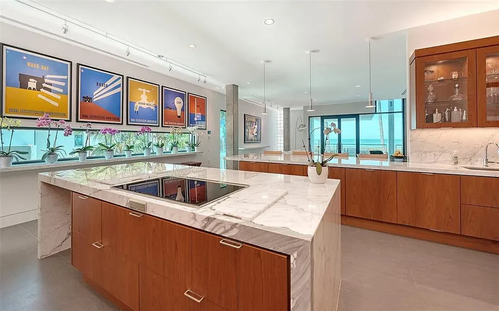 Gulf-front luxury home at 8250 Sanderling Rd in Sarasota, award-winning modern architecture with beach and lagoon frontage.
