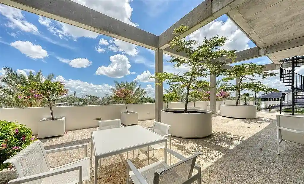 Gulf-front luxury home at 8250 Sanderling Rd in Sarasota, award-winning modern architecture with beach and lagoon frontage.