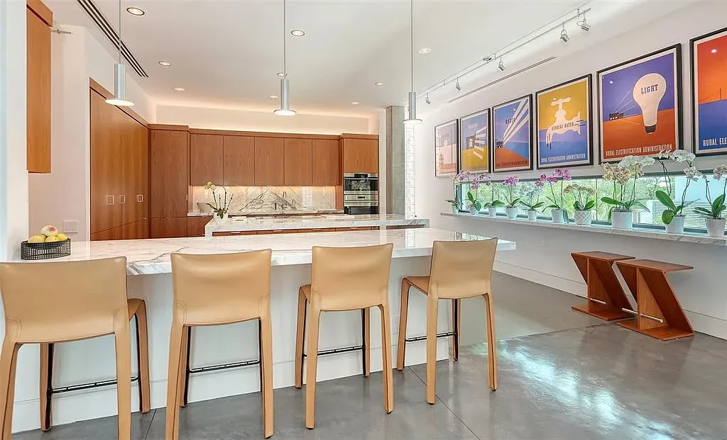 Gulf-front luxury home at 8250 Sanderling Rd in Sarasota, award-winning modern architecture with beach and lagoon frontage.