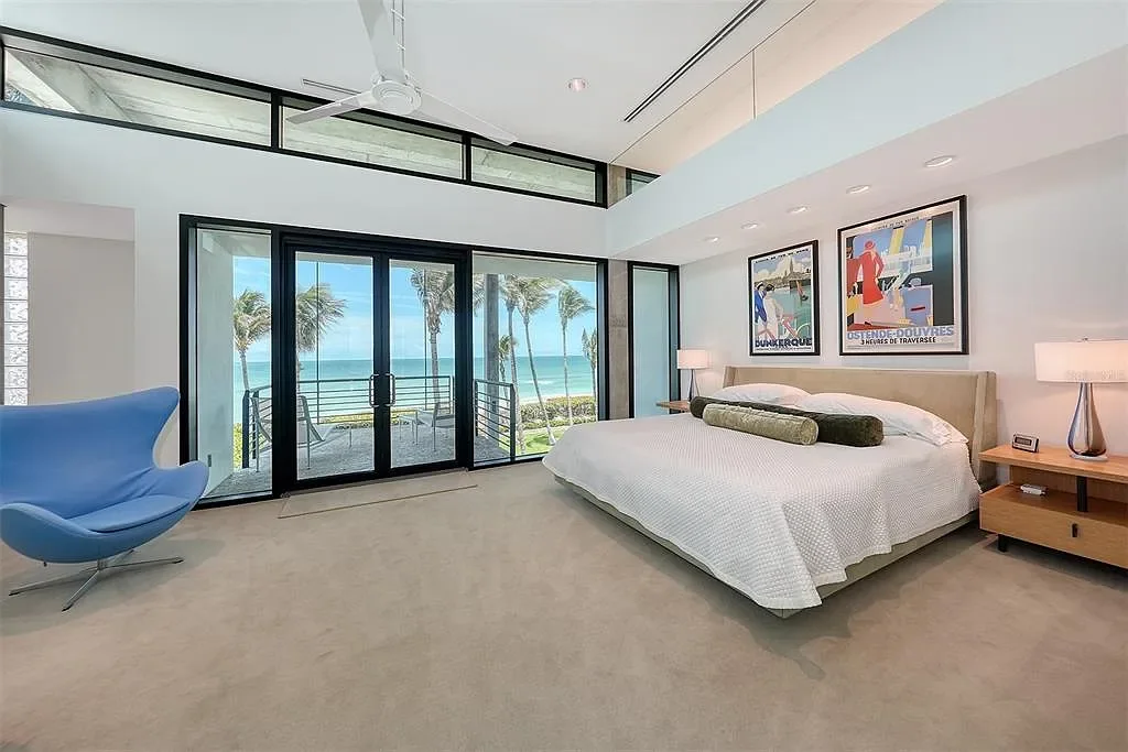Gulf-front luxury home at 8250 Sanderling Rd in Sarasota, award-winning modern architecture with beach and lagoon frontage.