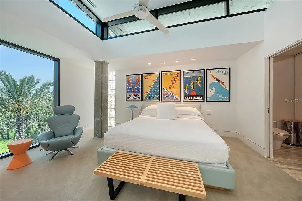 Gulf-front luxury home at 8250 Sanderling Rd in Sarasota, award-winning modern architecture with beach and lagoon frontage.