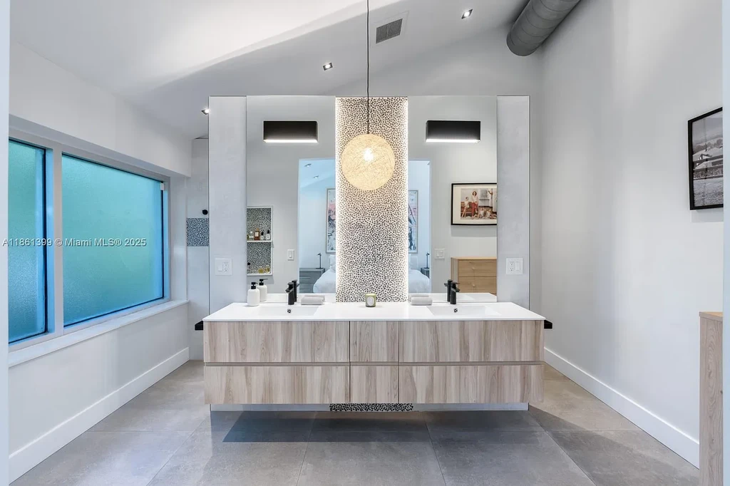 144 N Prospect Dr Coral Gables home for sale – $5.39M luxury residence designed by Hilario Candela featuring modern updates, private pool, and lush greenery.