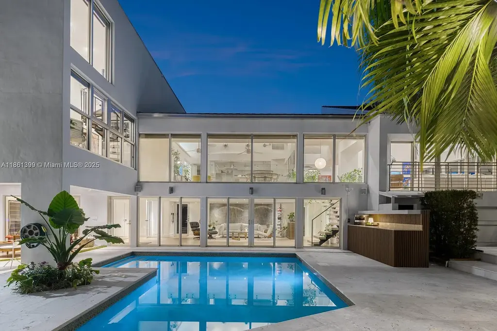 144 N Prospect Dr Coral Gables home for sale – $5.39M luxury residence designed by Hilario Candela featuring modern updates, private pool, and lush greenery.