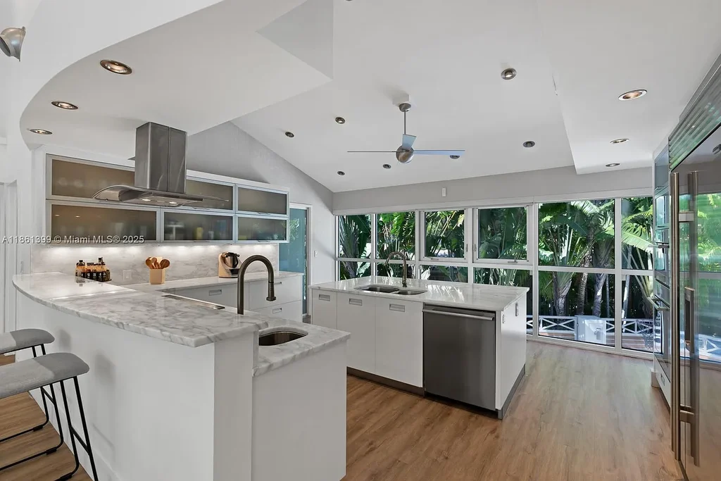 144 N Prospect Dr Coral Gables home for sale – $5.39M luxury residence designed by Hilario Candela featuring modern updates, private pool, and lush greenery.