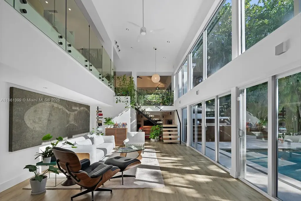 144 N Prospect Dr Coral Gables home for sale – $5.39M luxury residence designed by Hilario Candela featuring modern updates, private pool, and lush greenery.