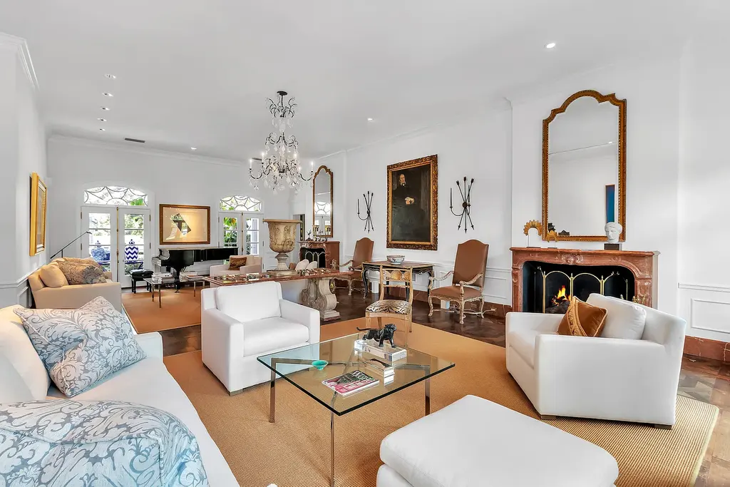 Elegant $5M Osprey Florida lakefront home featuring infinity pool spacious patio and stunning Gulf Coast sunset views
