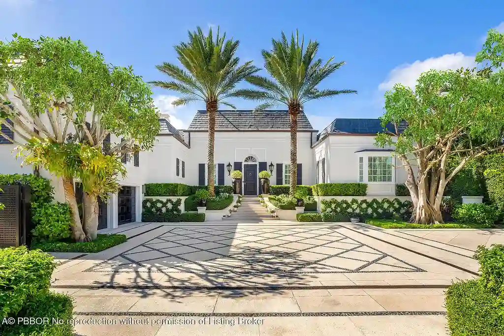 134 Casa Bendita Palm Beach luxury home for sale featuring 4 bedrooms, 5 baths, private pool, sun-drenched great room, and elegant Regency architecture.
