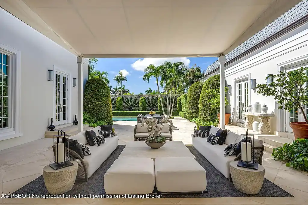 134 Casa Bendita Palm Beach luxury home for sale featuring 4 bedrooms, 5 baths, private pool, sun-drenched great room, and elegant Regency architecture.