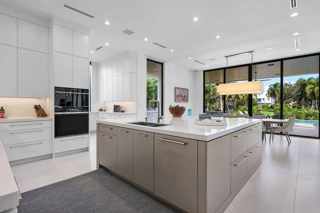 175 W Alexander Palm Road luxury waterfront home for sale in Boca Raton with modern design, private dock, resort-style pool, and Royal Palm Yacht Club location.