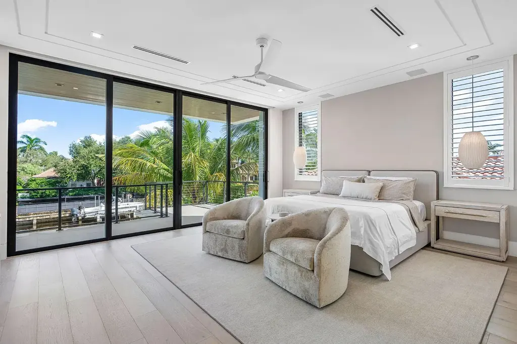 175 W Alexander Palm Road luxury waterfront home for sale in Boca Raton with modern design, private dock, resort-style pool, and Royal Palm Yacht Club location.