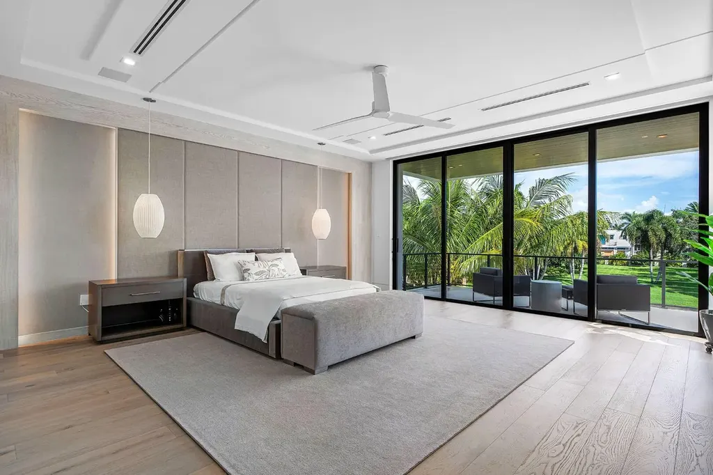 175 W Alexander Palm Road luxury waterfront home for sale in Boca Raton with modern design, private dock, resort-style pool, and Royal Palm Yacht Club location.