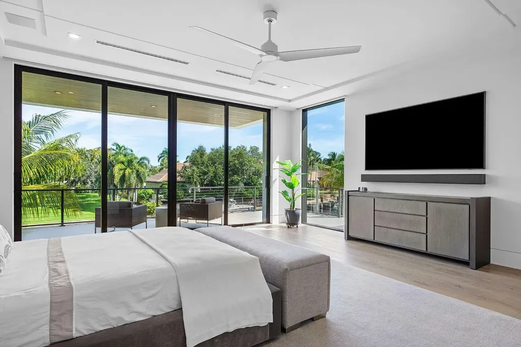 175 W Alexander Palm Road luxury waterfront home for sale in Boca Raton with modern design, private dock, resort-style pool, and Royal Palm Yacht Club location.
