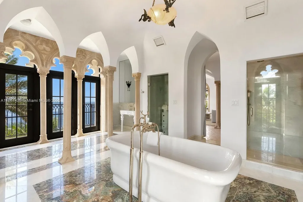 Luxury waterfront estate at 1840 S Bayshore Ln Miami, a $24 million Coconut Grove home for sale with Gothic design, infinity pool, and bay views.
