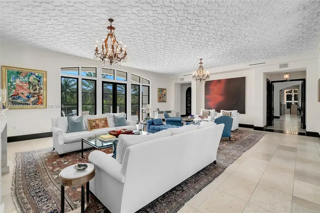 Luxury waterfront estate at 3305 S Moorings Way, Miami, FL 33133 with private dock, pool, 7 bedrooms, 9 bathrooms, and panoramic Biscayne Bay views.