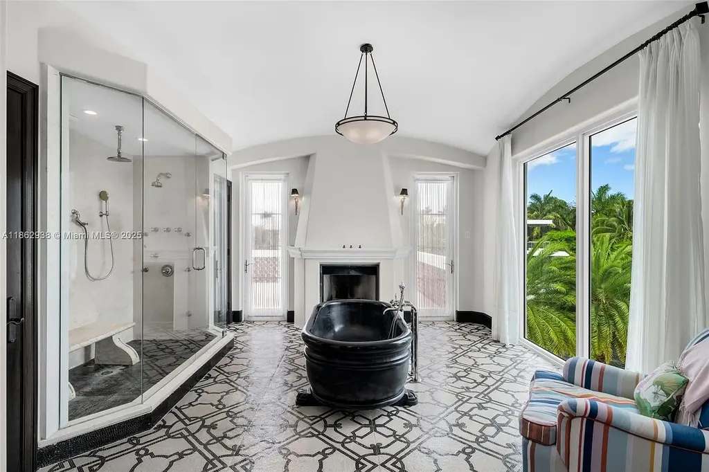 Luxury waterfront estate at 3305 S Moorings Way, Miami, FL 33133 with private dock, pool, 7 bedrooms, 9 bathrooms, and panoramic Biscayne Bay views.