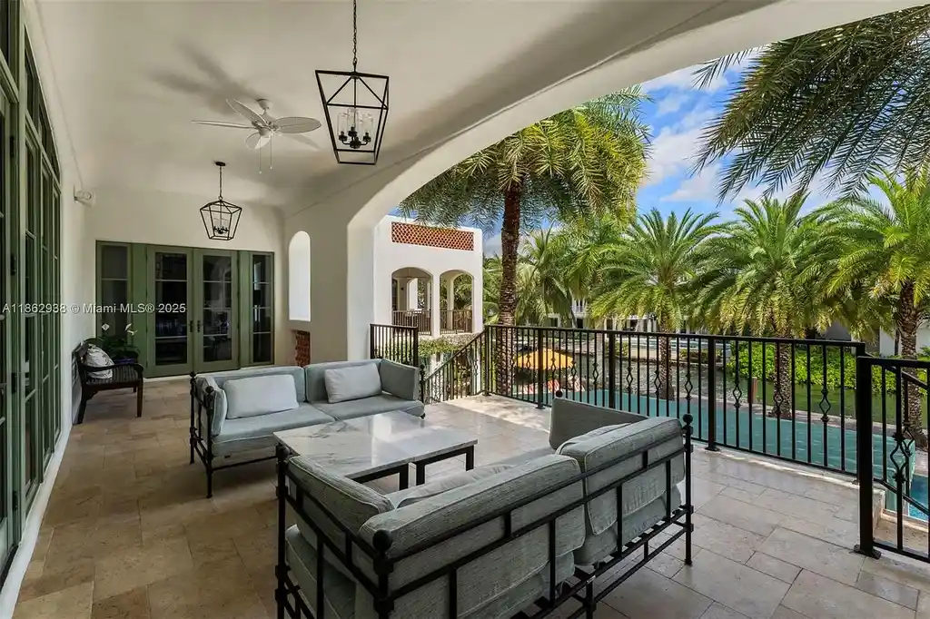 Luxury waterfront estate at 3305 S Moorings Way, Miami, FL 33133 with private dock, pool, 7 bedrooms, 9 bathrooms, and panoramic Biscayne Bay views.