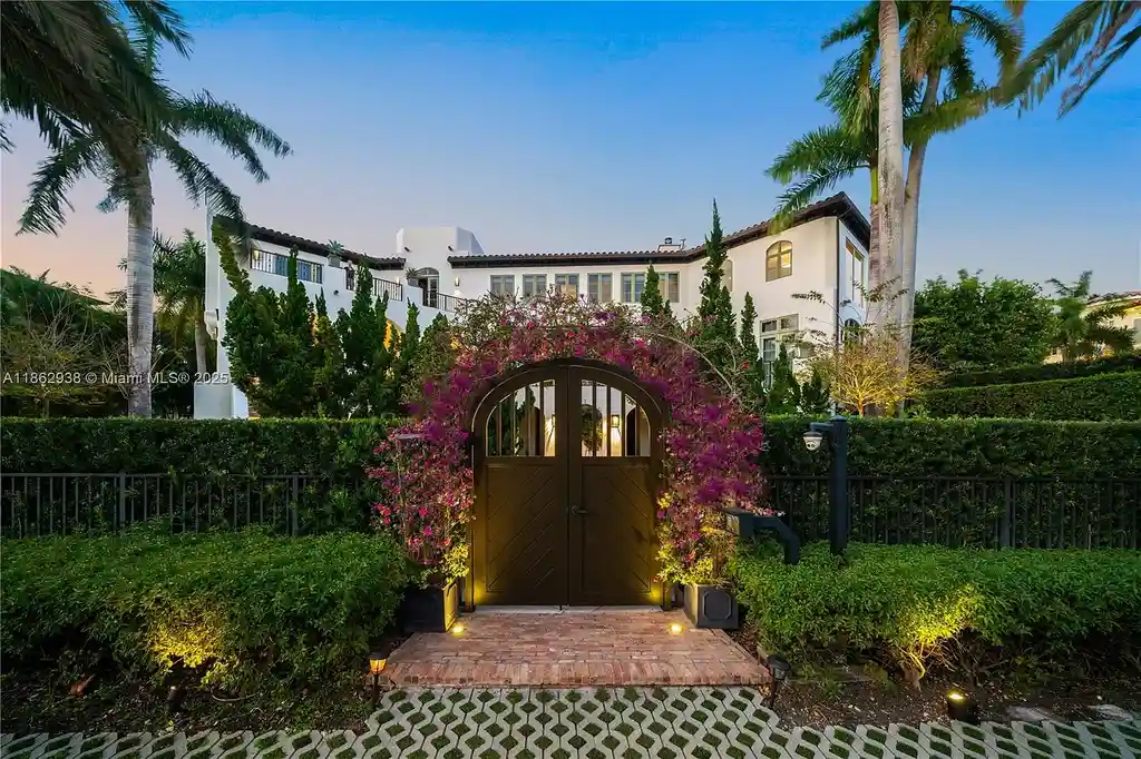 Luxury waterfront estate at 3305 S Moorings Way, Miami, FL 33133 with private dock, pool, 7 bedrooms, 9 bathrooms, and panoramic Biscayne Bay views.